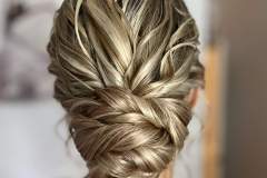 Low textured bun wedding hair. Created by Surrey based wedding hairstylist, Lucy Hayward.
